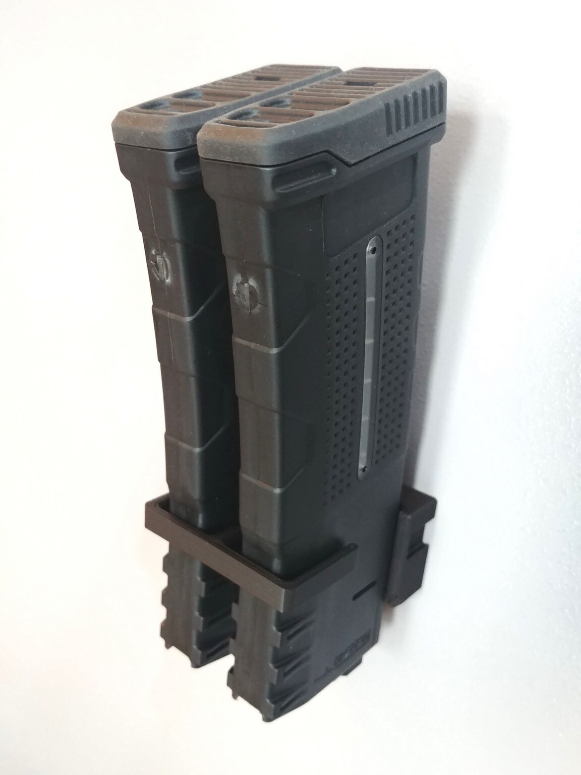 AR Mag Holder storing rifle magazines inside a gun cabinet